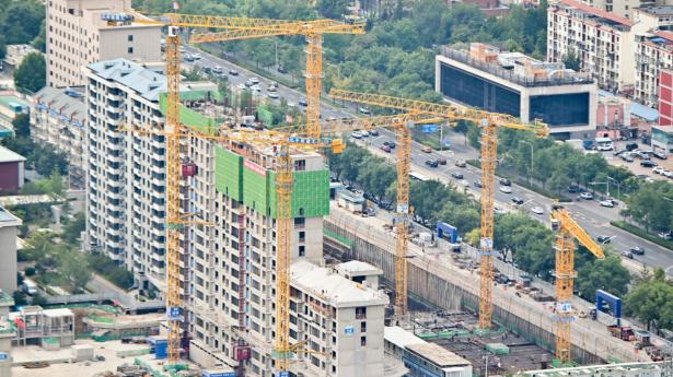 Ejendomsbyggeriet i Beijing fortsætter trods en dyb krise i sektoren. Foto: Wang Zhao/AFP/Ritzau Scanpix