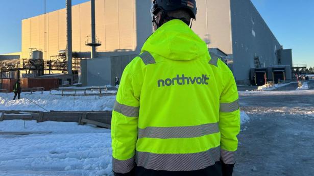 FILE PHOTO: A man stands in front of the Northvolt Ett factory in Skelleftea