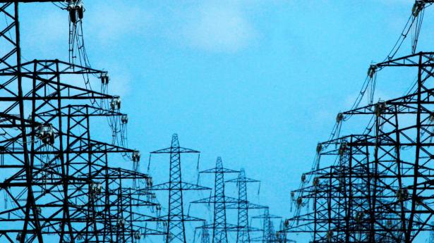 FILE PHOTO: Power lines and pylons stretch out from Dungeness nuclear power station