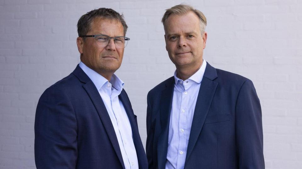 Kim Mouritsen (t.v.) og Lars Thomsen (t.h.) deles om posten som adm. direktør i Sparekassen Danmark. 